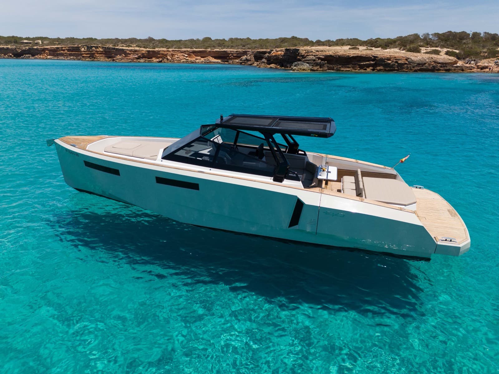 Modern yacht in turquoise Ibiza water